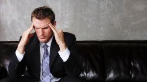 Handsome executive working on Laptop.